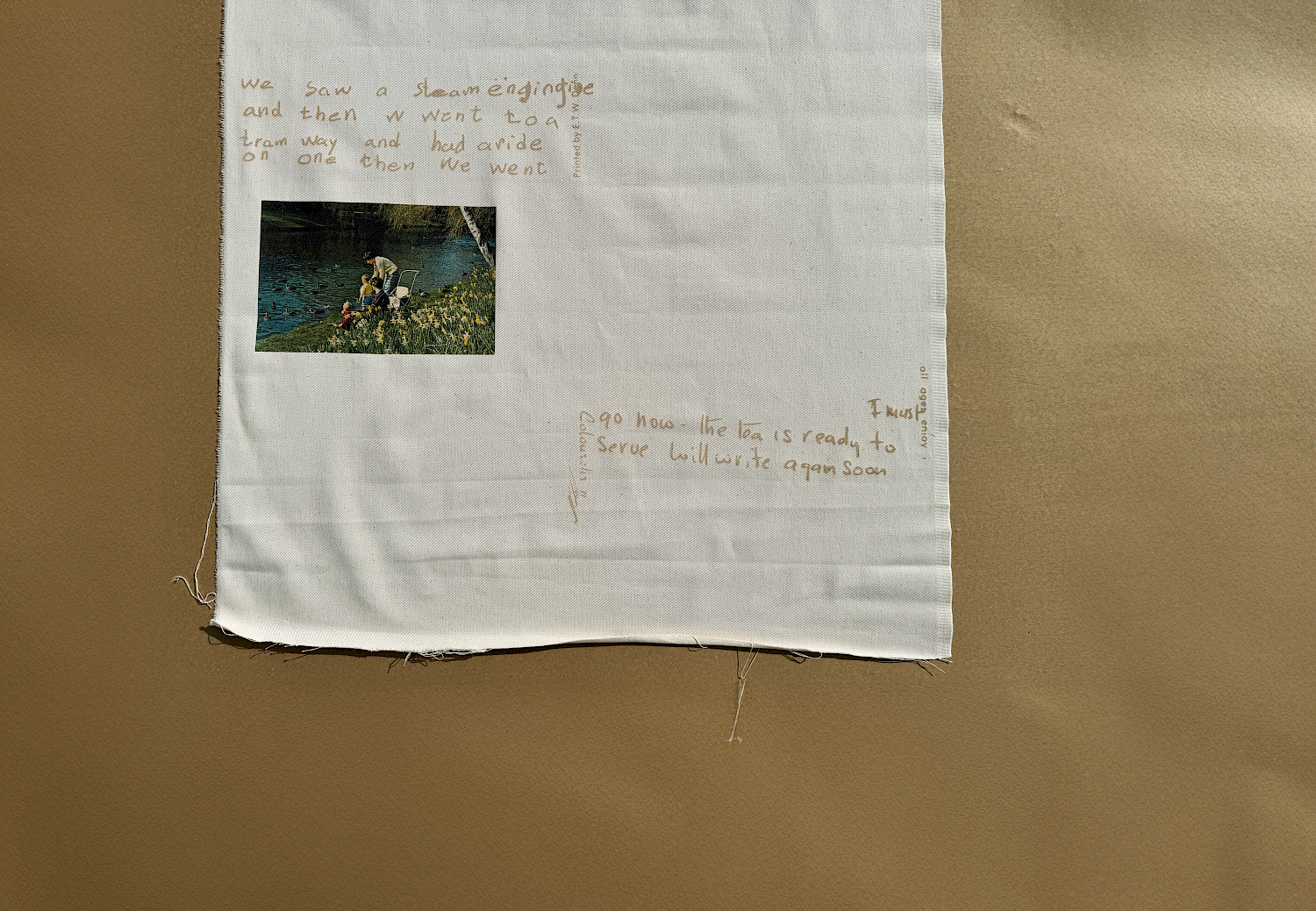 A close up of a visual poem on fabric responding to the same postcards archive A close up of a visual poem on fabric responding to the same postcards archive